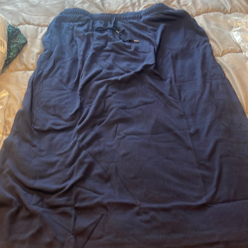 Woman within lot of 3 cotton drawstring skirts